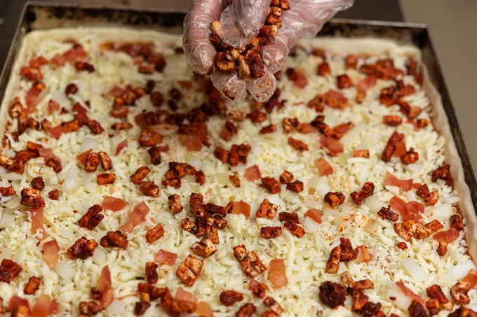 Galaxy Pizza fully loaded with pepperoni salami beef ham at Chicago Deep Dish Calgary